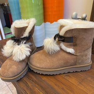 UGG’s with fur balls .
